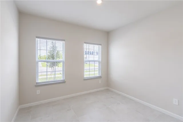 an empty room with windows