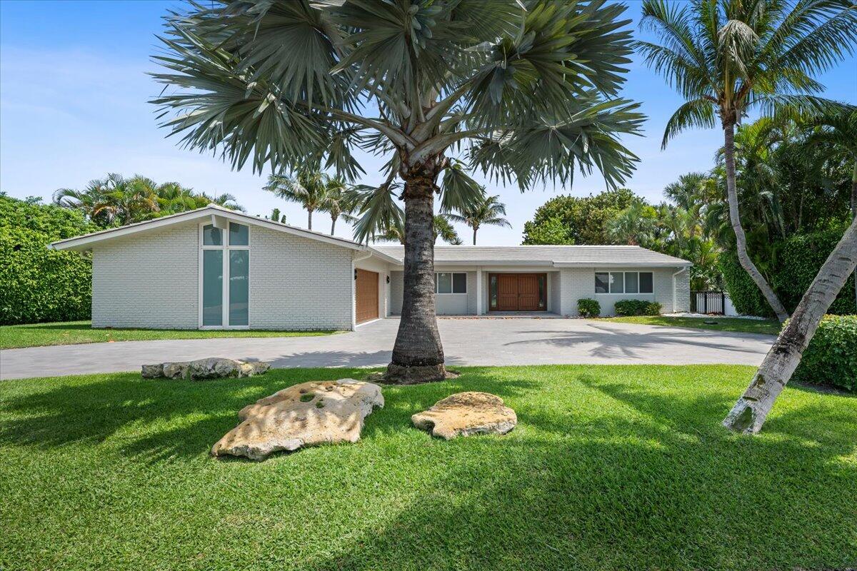 2259 Ibis Isle Road East Palm Beach, FL 33480 - Photo 1 of 35 a front view of house with yard and green space