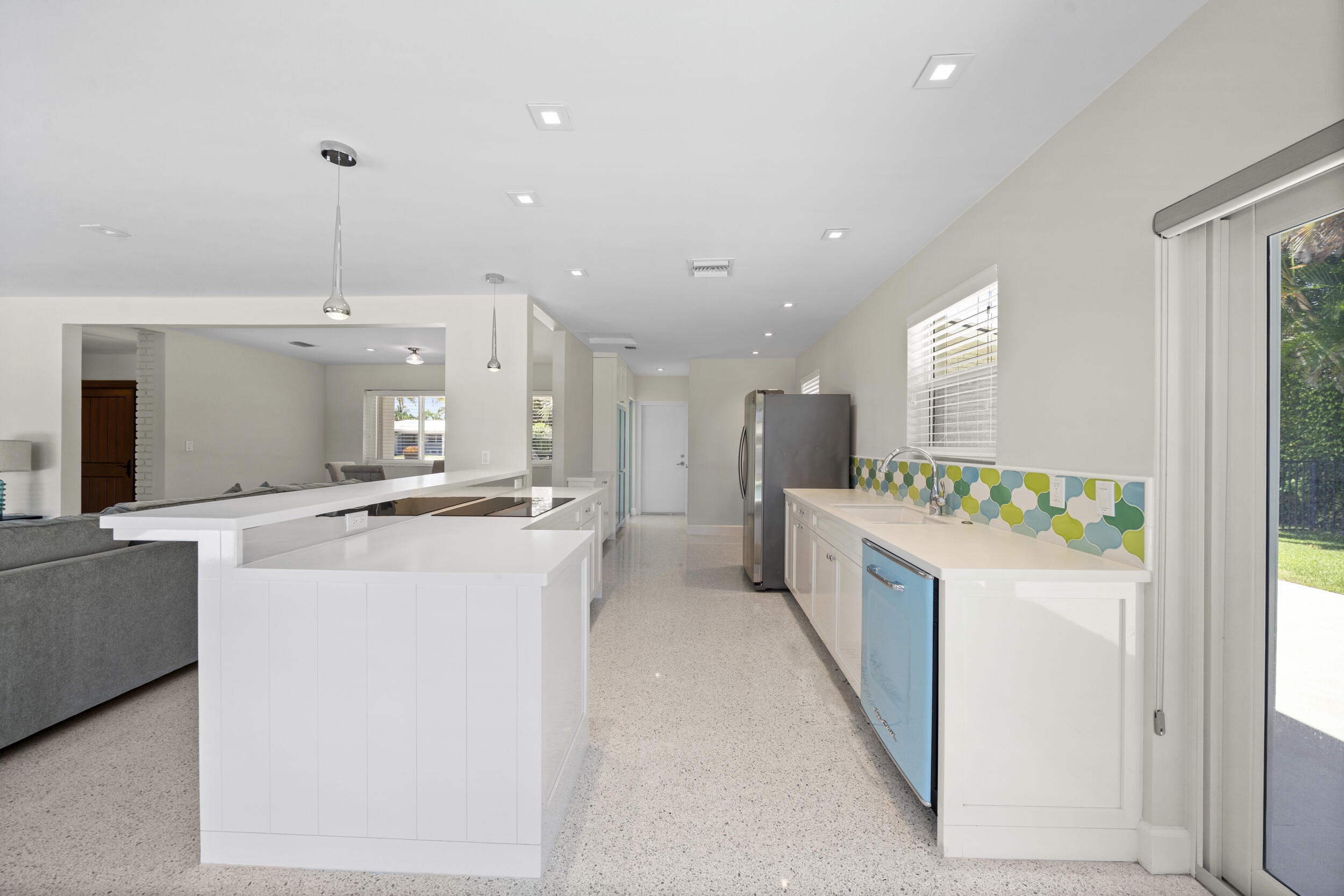 2259 Ibis Isle Road East Palm Beach, FL 33480 - Photo 12 of 35 a kitchen with kitchen island sink stove and refrigerator