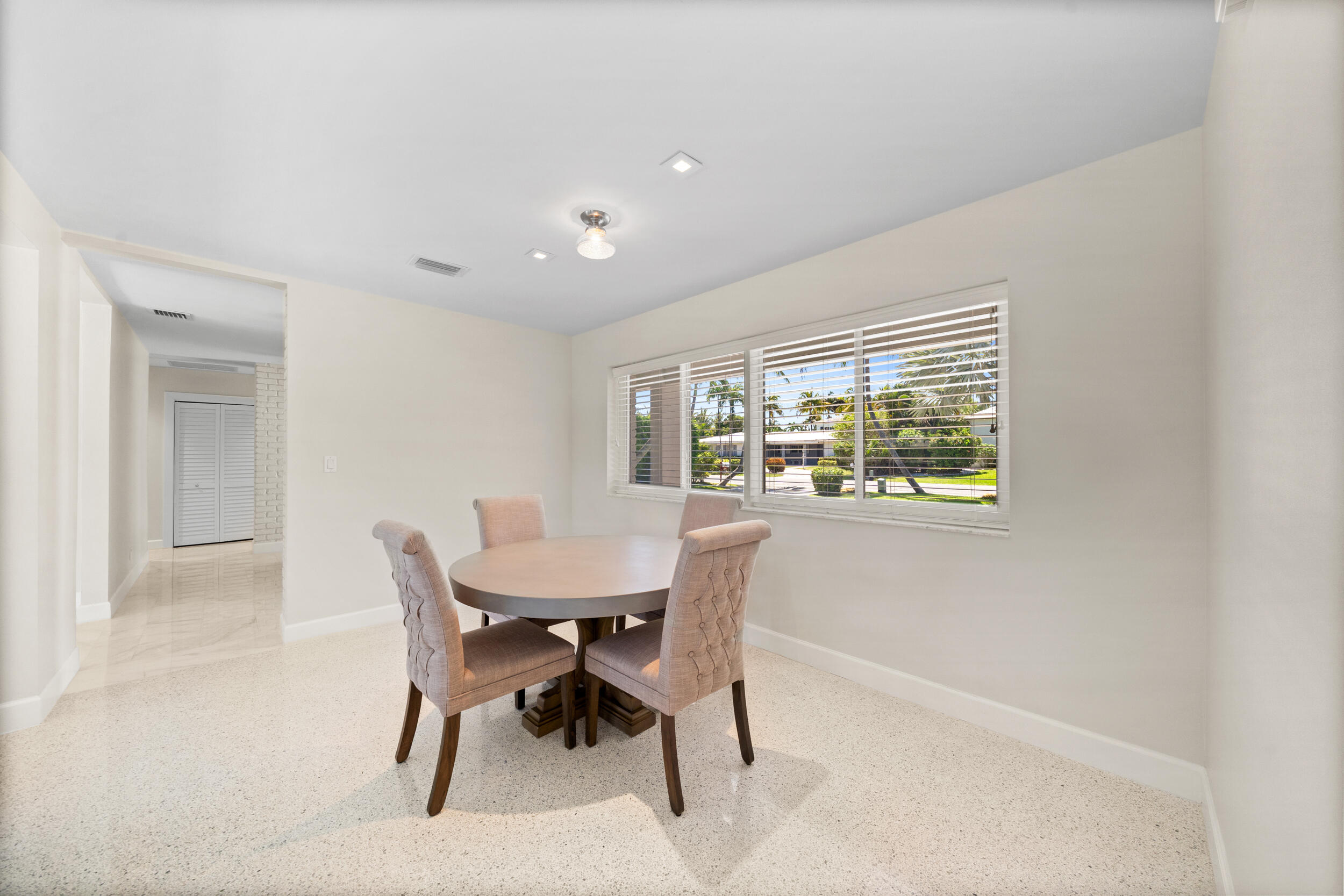 2259 Ibis Isle Road East Palm Beach, FL 33480 - Photo 15 of 35 a view of a dining room with furniture and a window