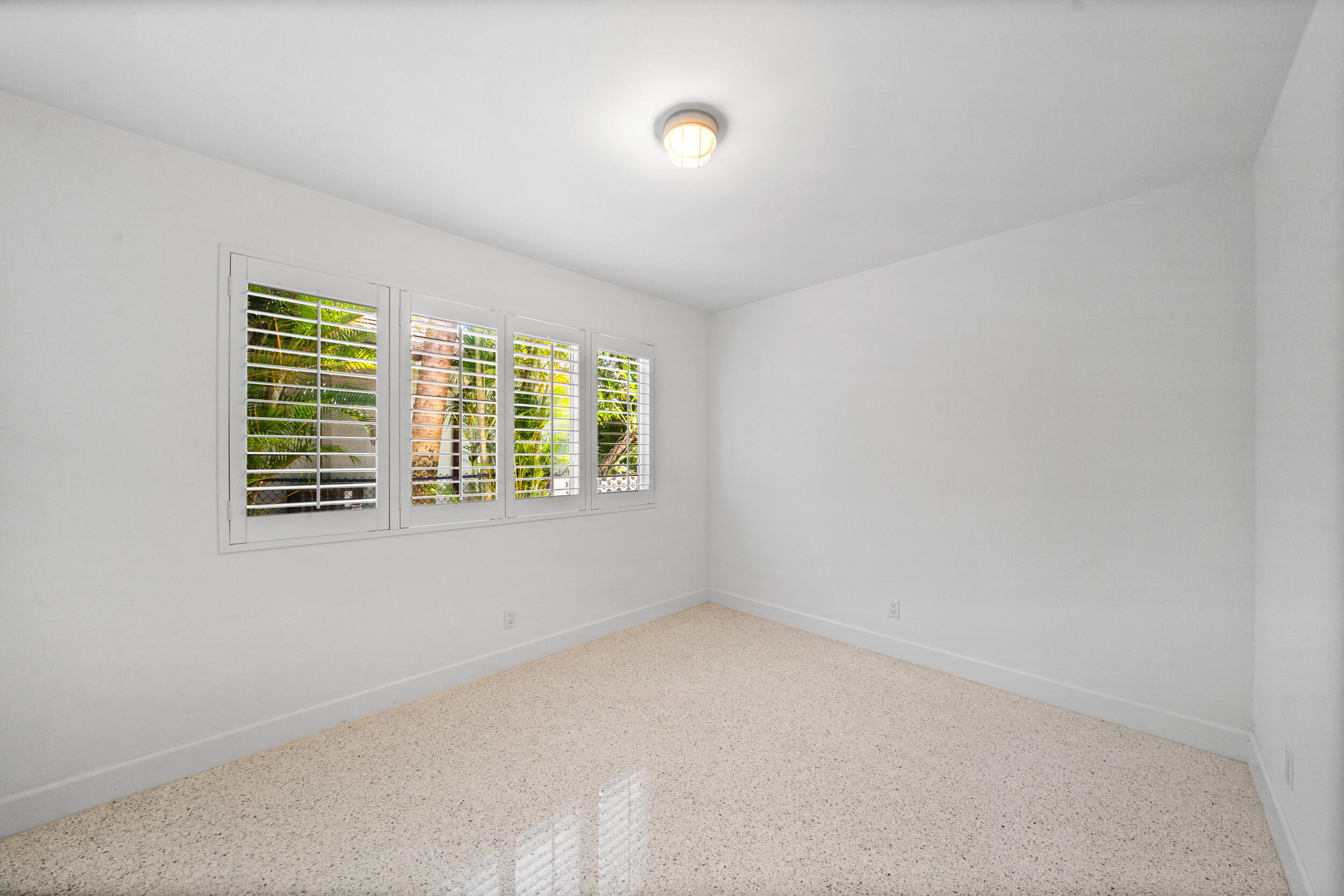 2259 Ibis Isle Road East Palm Beach, FL 33480 - Photo 18 of 35 a view of an empty room with a window