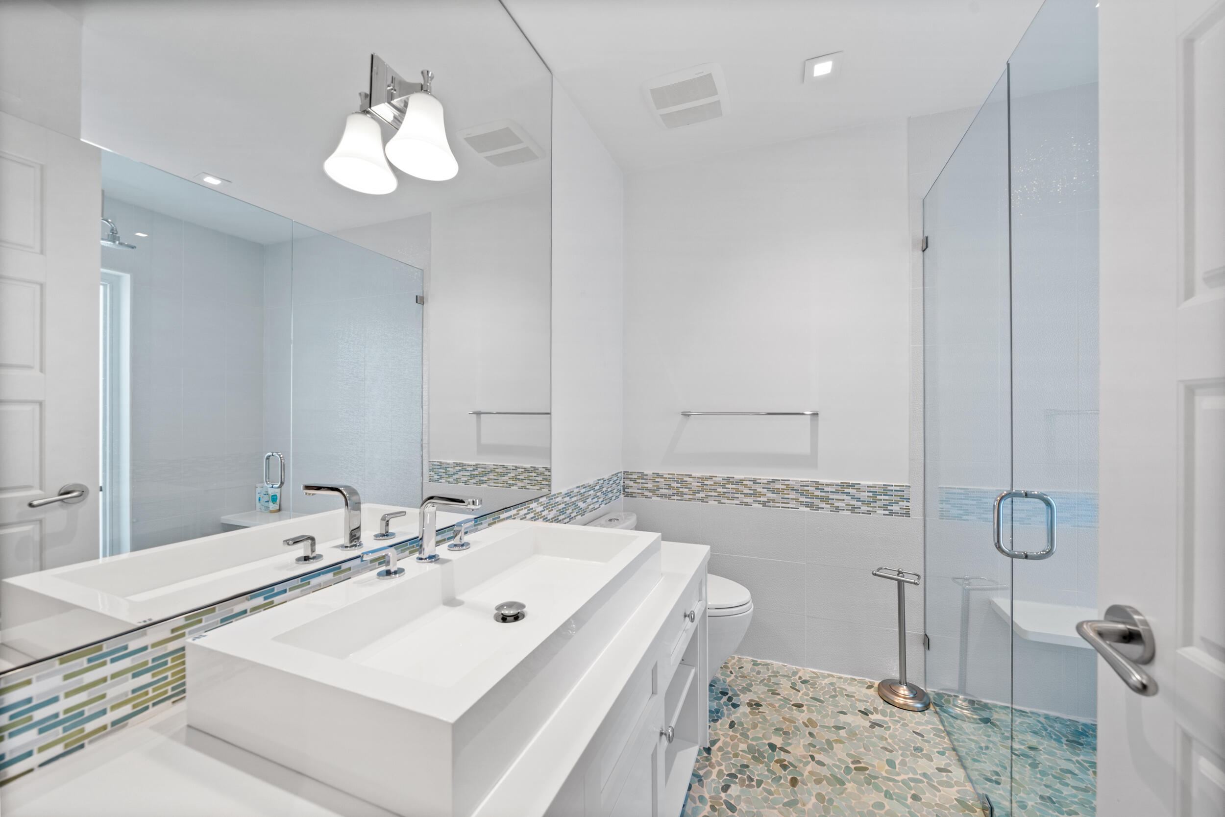 2259 Ibis Isle Road East Palm Beach, FL 33480 - Photo 20 of 35 a bathroom with a sink a toilet and shower