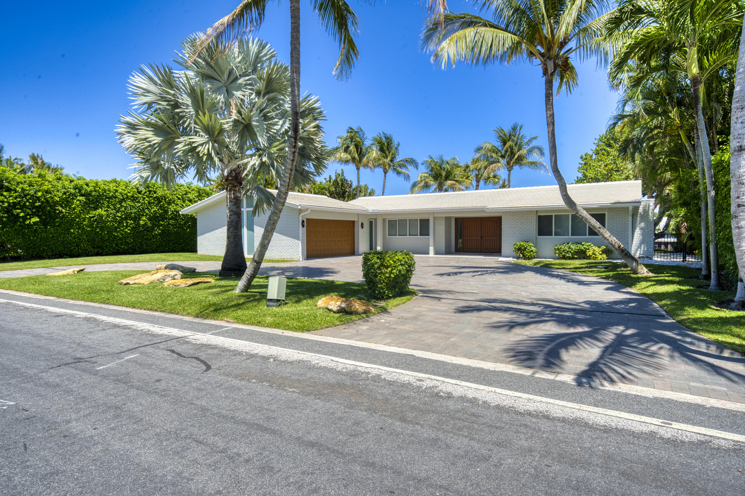 2259 Ibis Isle Road East Palm Beach, FL 33480 - Photo 3 of 35 a view of a house with backyard and a tree