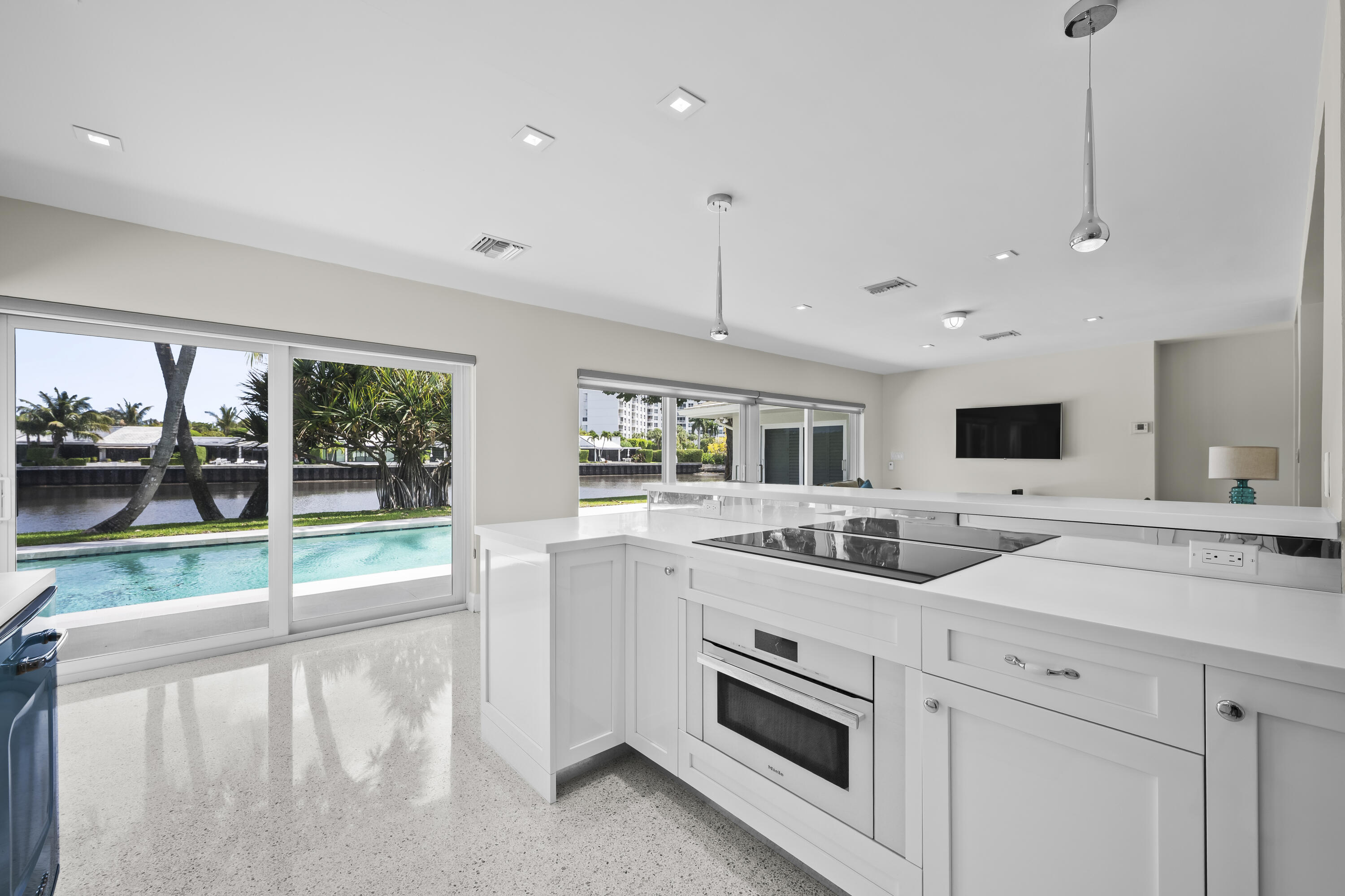 2259 Ibis Isle Road East Palm Beach, FL 33480 - Photo 8 of 35 a kitchen with a sink and a stove top oven