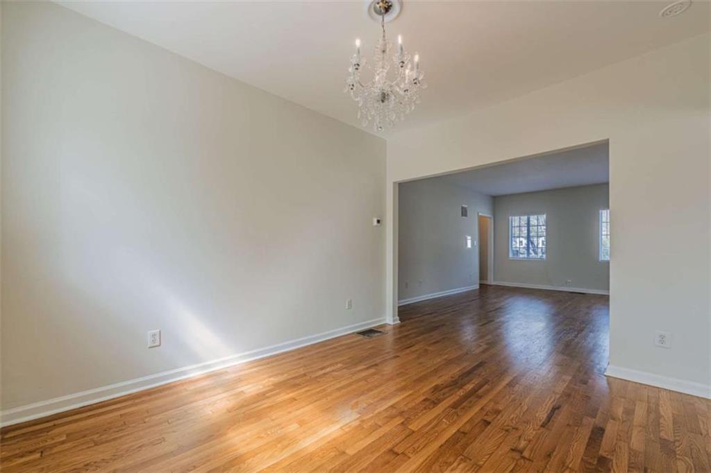 1977 North Decatur Road Atlanta, GA 30307 - Photo 15 of 59 a view of an empty room with wooden floor and a window