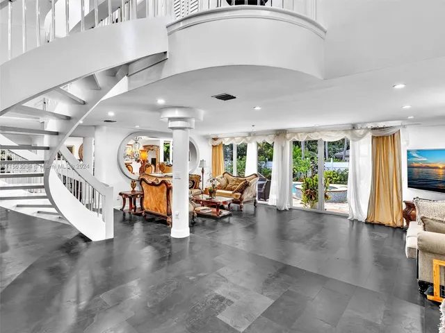 a kitchen with stainless steel appliances a sink and a refrigerator