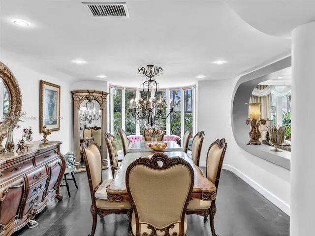 a view of a livingroom with furniture and a window