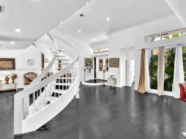 a view of a chair and table in backyard with plants