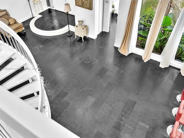 an aerial view of residential houses with outdoor space and street view