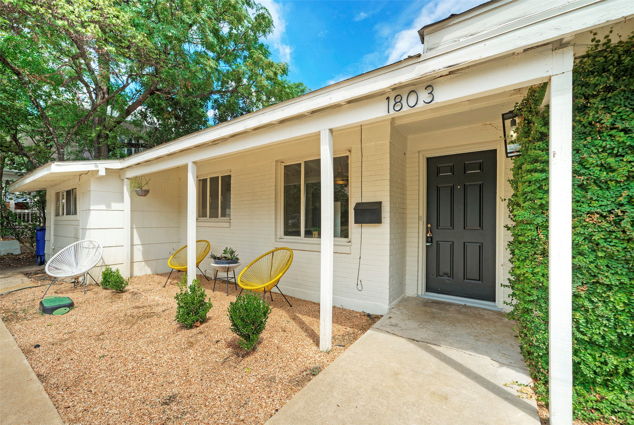 1803 Pearl Street Austin, TX 78701 - Photo 30 of 33 a front view of a house with a patio