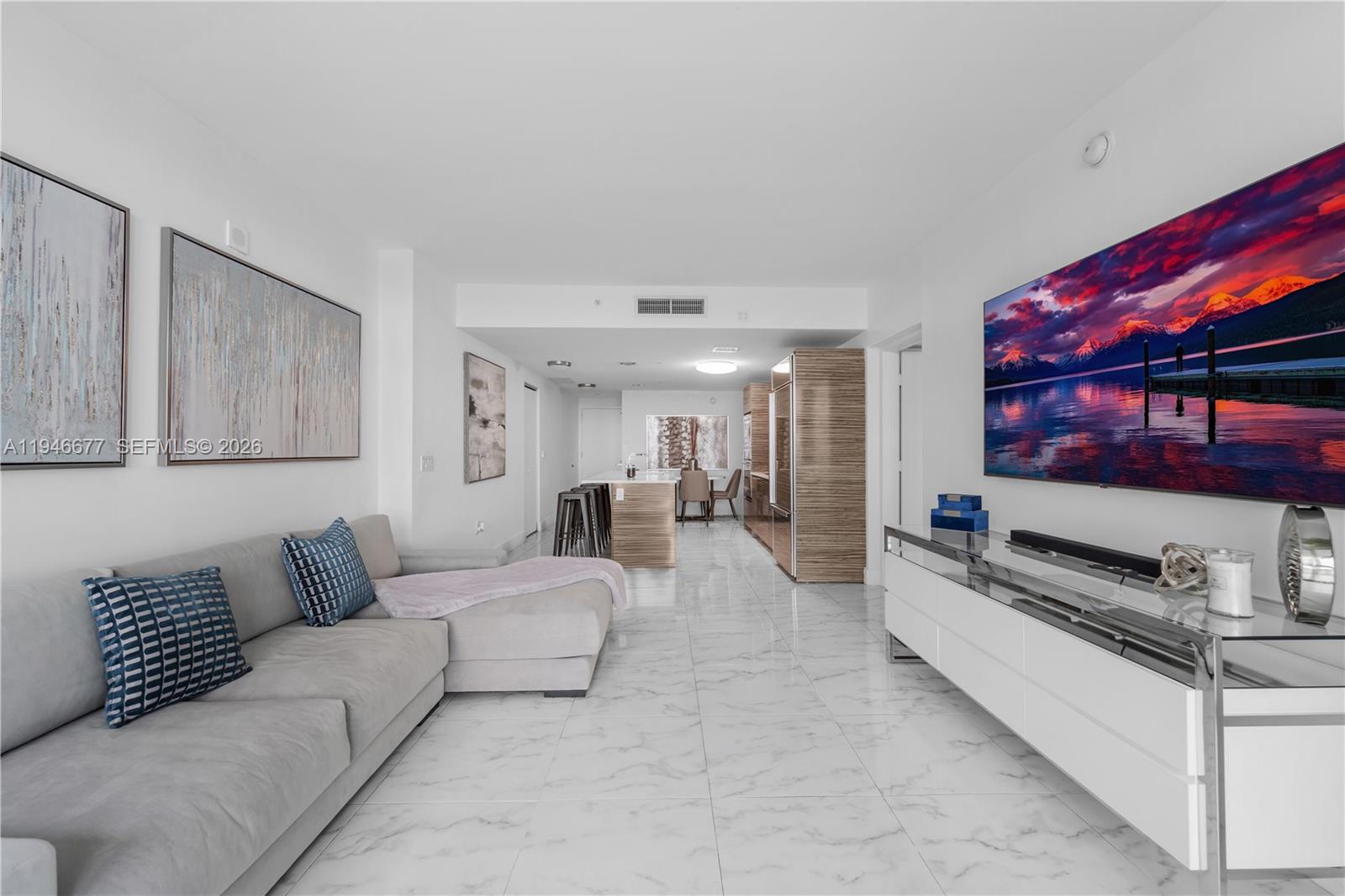 460 Northeast 28th Street, Unit 3002 Miami, FL 33137 - Photo 19 of 32 a living room with furniture and a flat screen tv