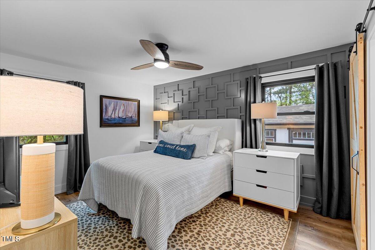 5700 Tully Court Raleigh, NC 27609 - Photo 19 of 26 a bedroom with a bed and a window