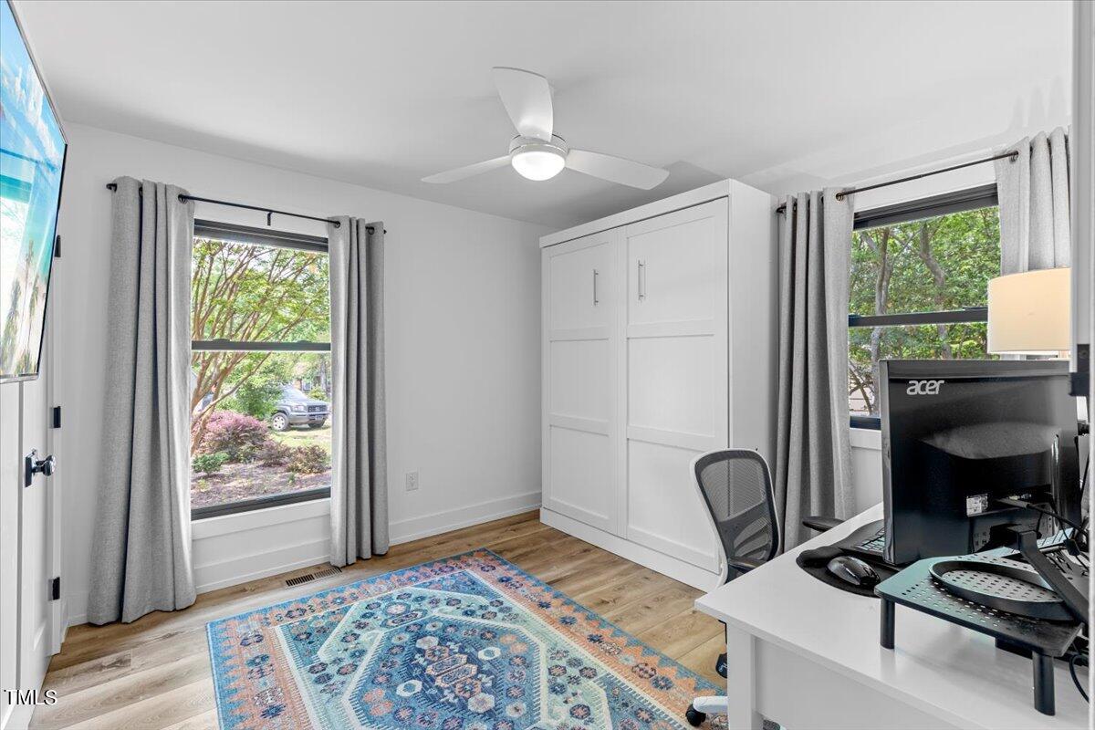 5700 Tully Court Raleigh, NC 27609 - Photo 23 of 26 a bedroom with furniture and a window