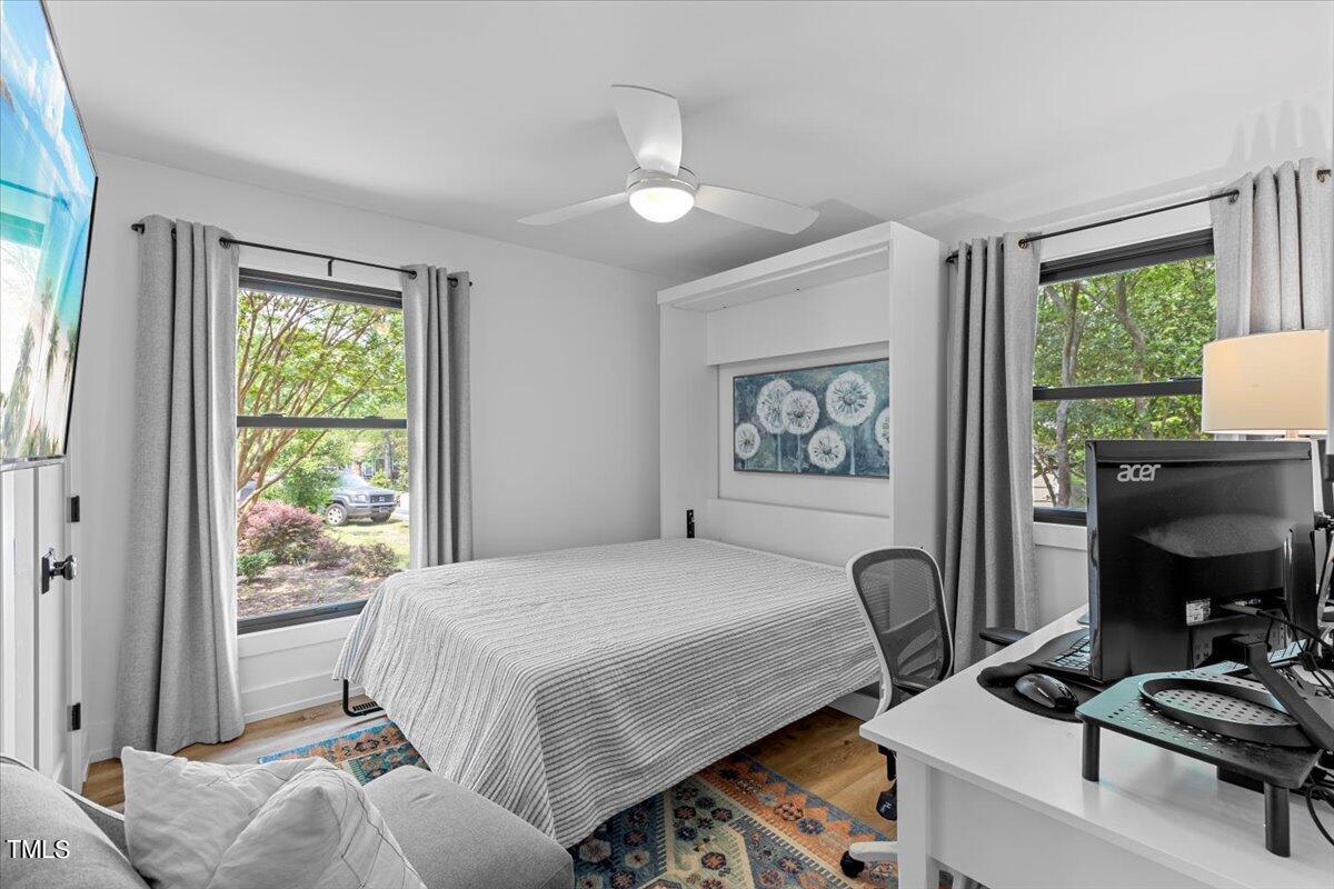 5700 Tully Court Raleigh, NC 27609 - Photo 24 of 26 a bedroom with a bed and a window