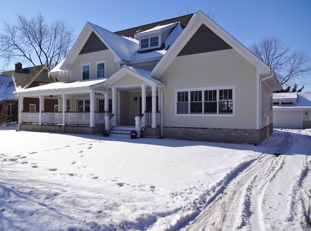 210 Walnut Street Frankfort, IL 60423 - Photo 2 of 2 a front view of a house with a yard covered in snow