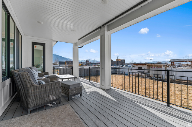 1426 South 1450th Street West Mapleton, UT 84664 - Photo 38 of 50 Expansive covered outdoor patio featuring composite decking and black metal railings