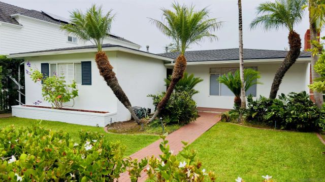 a front view of house with small garden