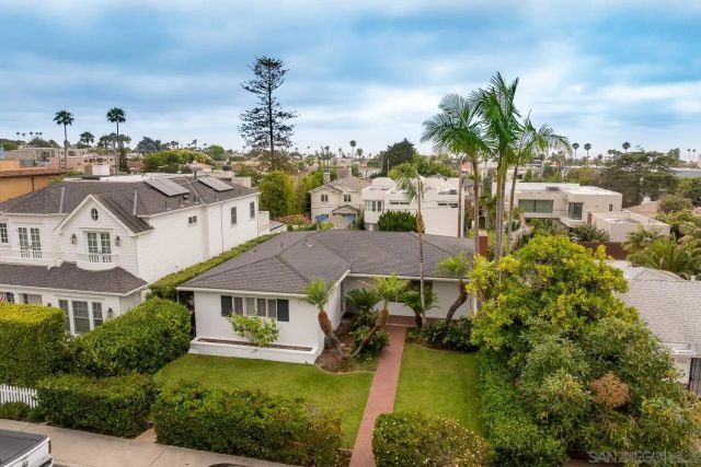 aerial view of a house with a garden and plants