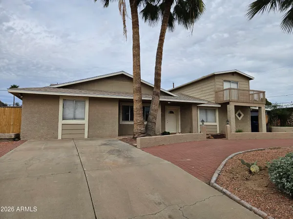 front view of a house with a yard