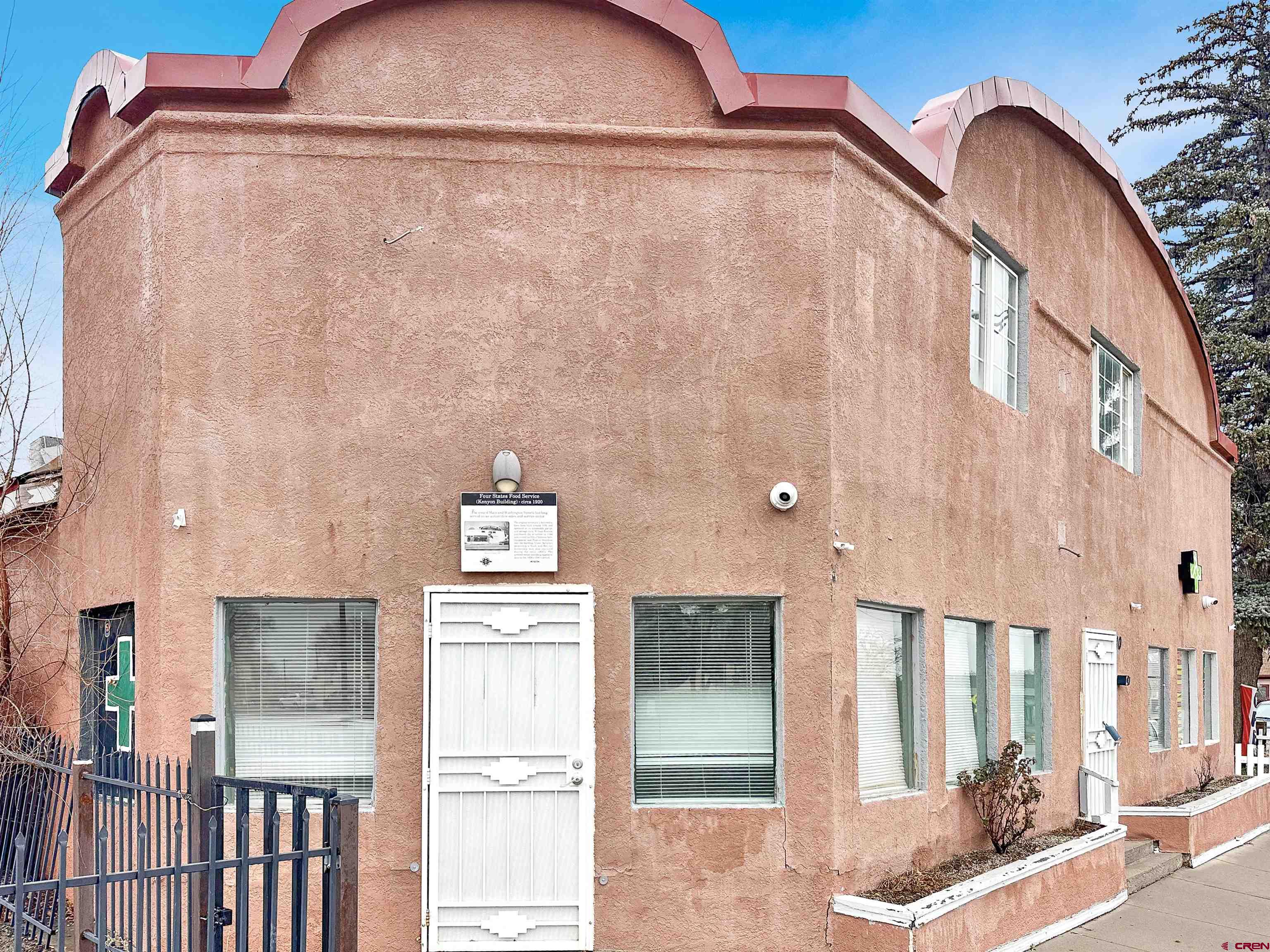 a view of a brick house with entryway