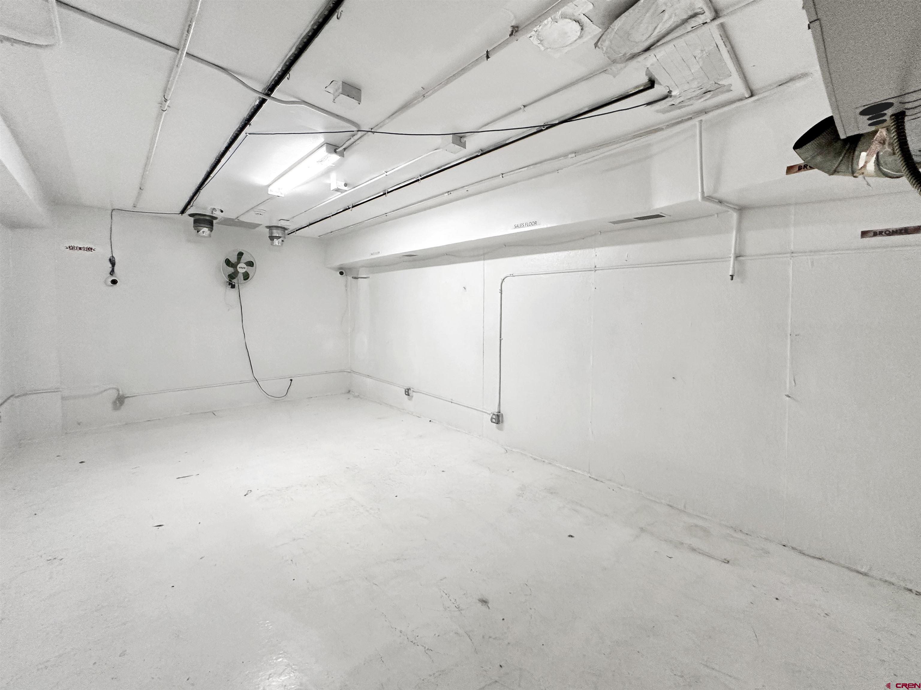 310 East Main Street Cortez, CO 81321 - Photo 8 of 21 a view of a room with racks on the wall