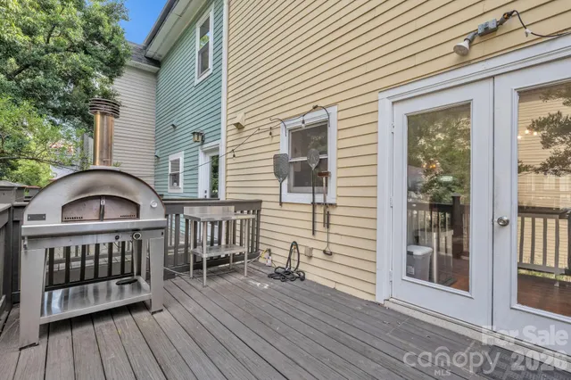 a view of a wooden chairs on the deck