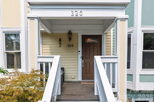 a front view of a house with a blue door