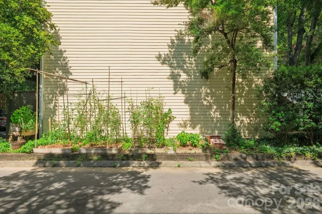a backyard of a house with outdoor seating