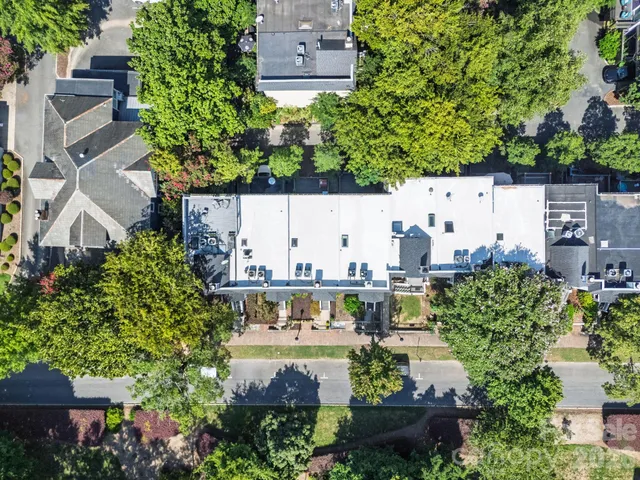 an aerial view of a house with outdoor space