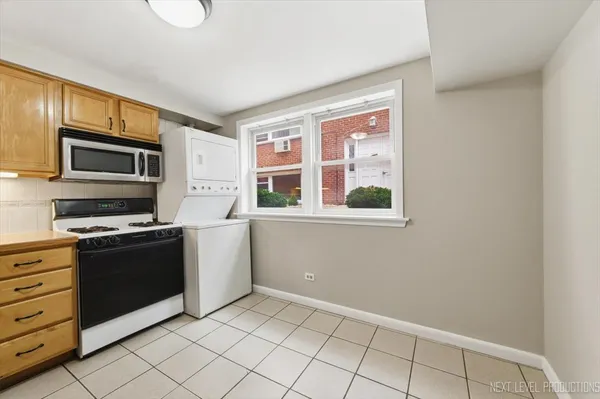 a kitchen with stainless steel appliances a stove and a refrigerator