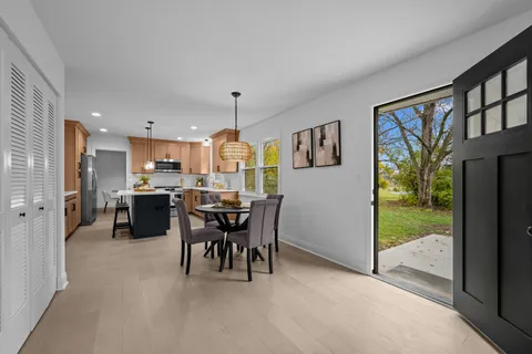 a bathroom with a sink a mirror a toilet and a shower