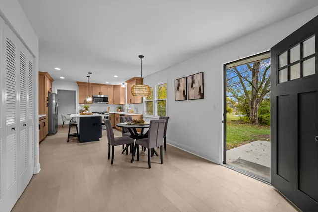 a bathroom with a sink a mirror a toilet and a shower
