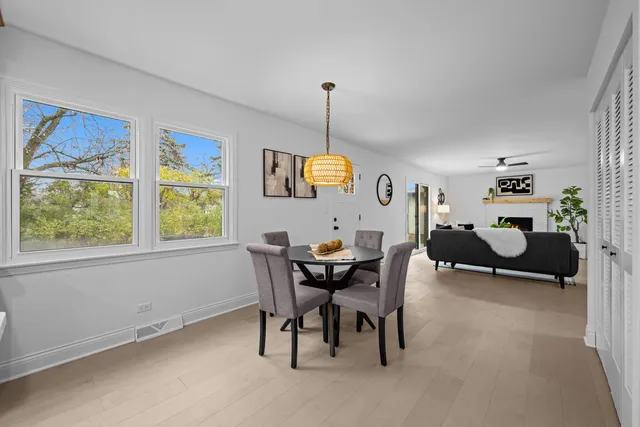 an empty room with a hallway and a window