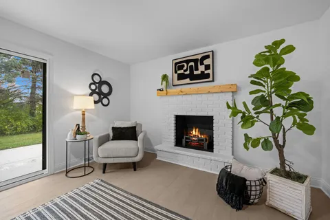 a bathroom with a double vanity sink toilet and mirror