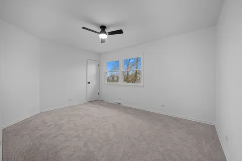 an aerial view of residential houses with city view