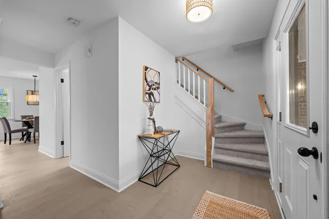 a view of a dining room and a kitchen table and chairs