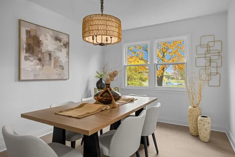a view of a dining room with furniture and window