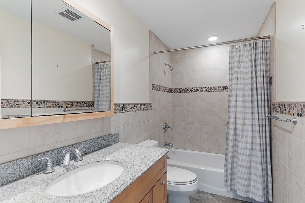 147 Silver Hill Road Concord, MA 01742 - Photo 20 of 28 a bathroom with a granite countertop sink toilet and shower