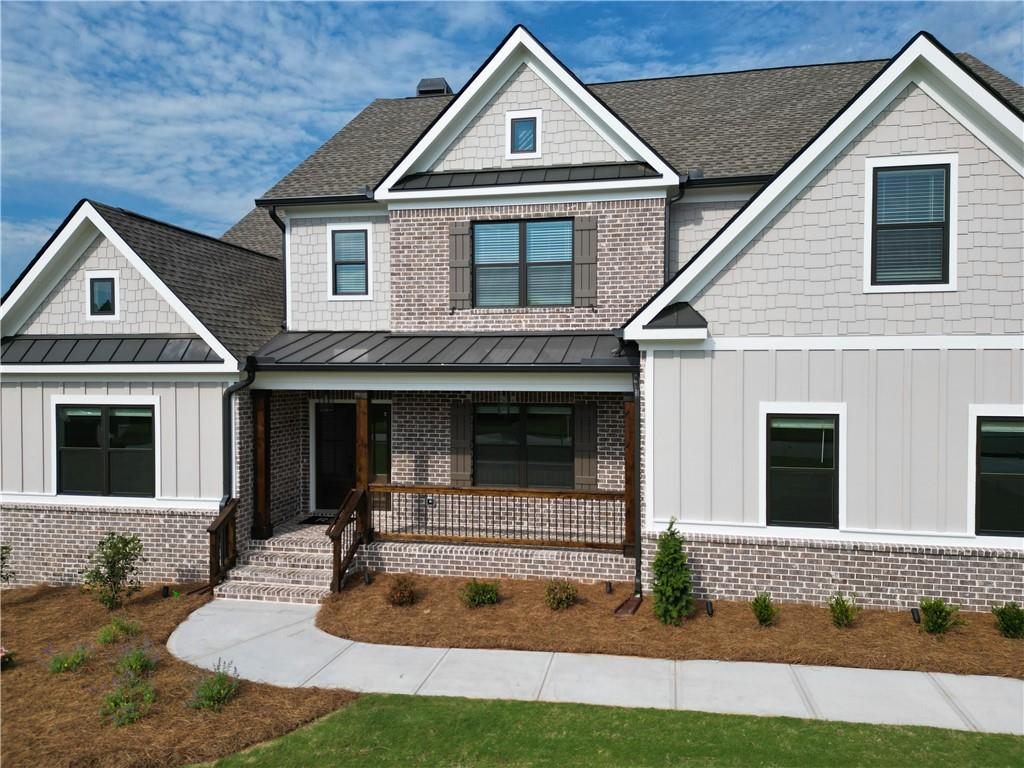 2113 Stonegate Way Monroe, GA 30656 - Photo 4 of 43 a front view of a house with garden