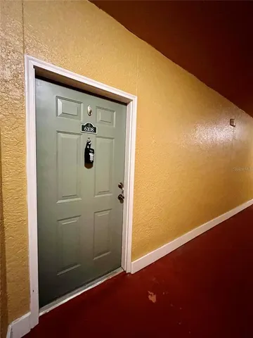 a kitchen with a stove a sink and a refrigerator