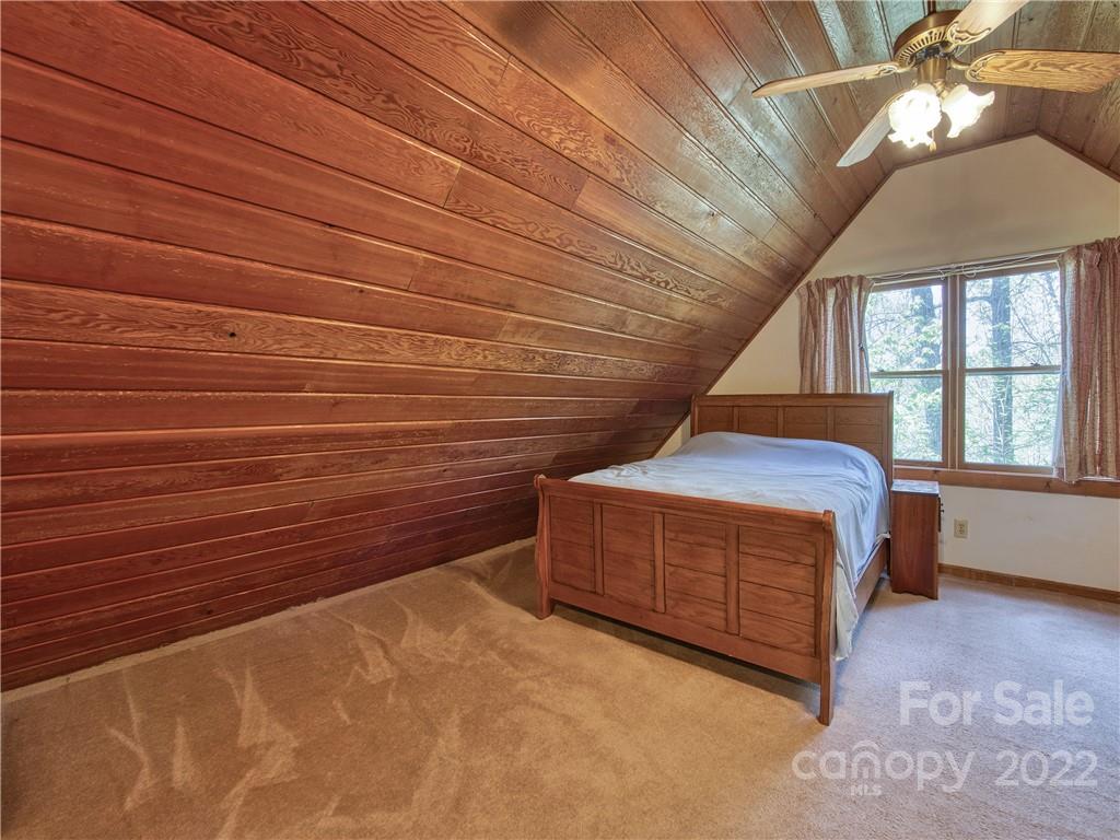86 Confederate Road Clyde, NC 28721 - Photo 17 of 26 a room with a bed and a window