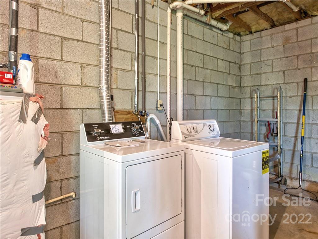 86 Confederate Road Clyde, NC 28721 - Photo 20 of 26 a utility room with dryer and washer