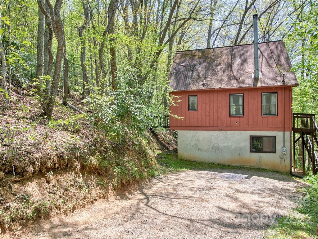 86 Confederate Road Clyde, NC 28721 - Photo 2 of 26 a view of a house with a yard