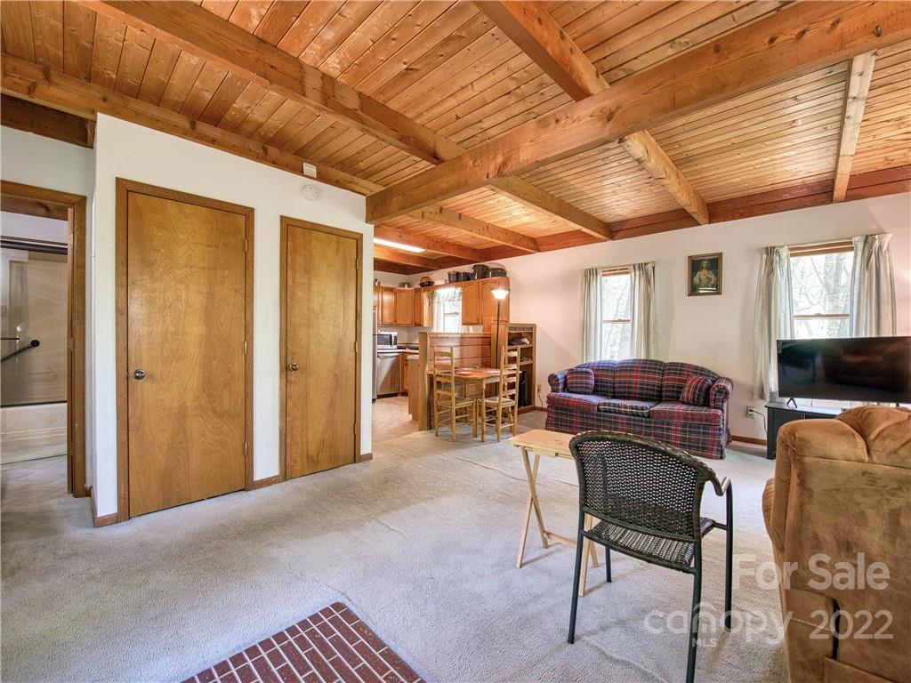86 Confederate Road Clyde, NC 28721 - Photo 9 of 26 a living room with furniture and a wooden floor