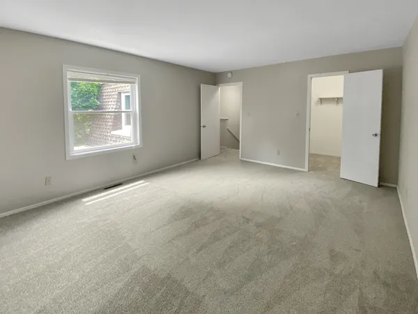 a view of an empty room with a window