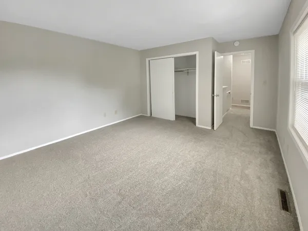 an empty room with a bathroom