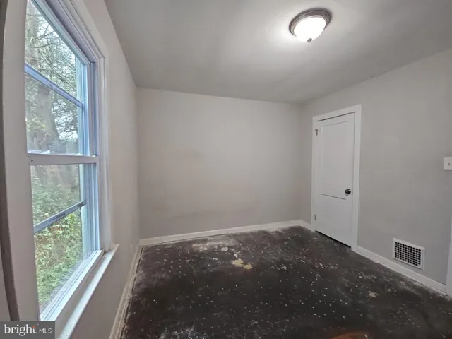 en empty room with windows