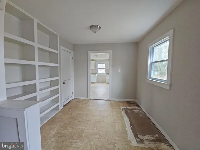 a view of an empty room with a window