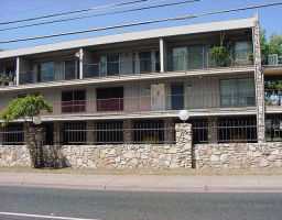 a view of a building with a street