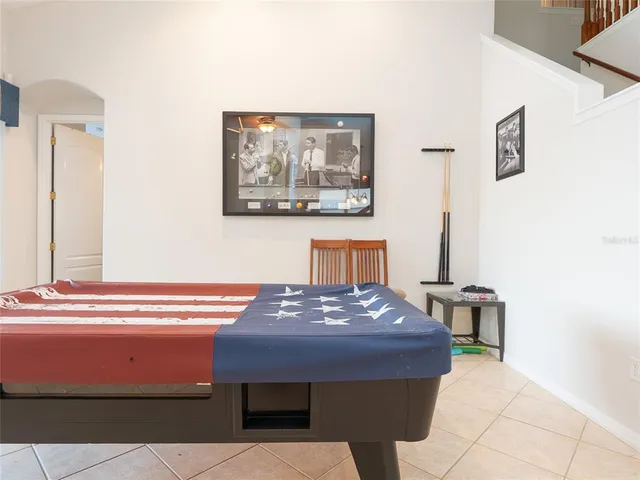 a dining room with furniture and a chandelier